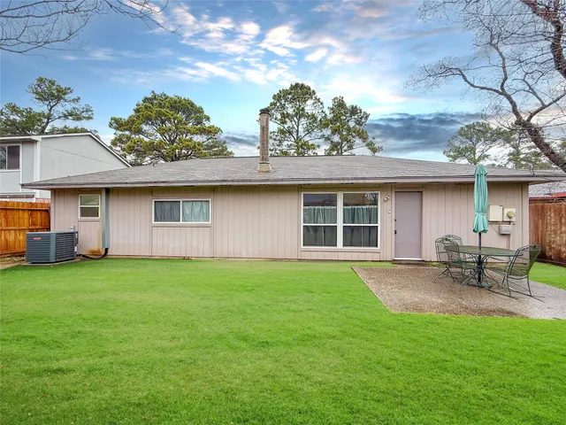 a front view of house with yard and outdoor seating
