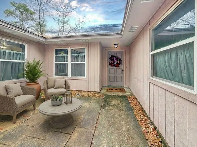 a view of a porch with furniture