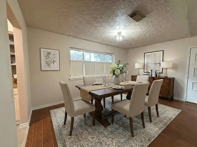 a view of a dining room with furniture