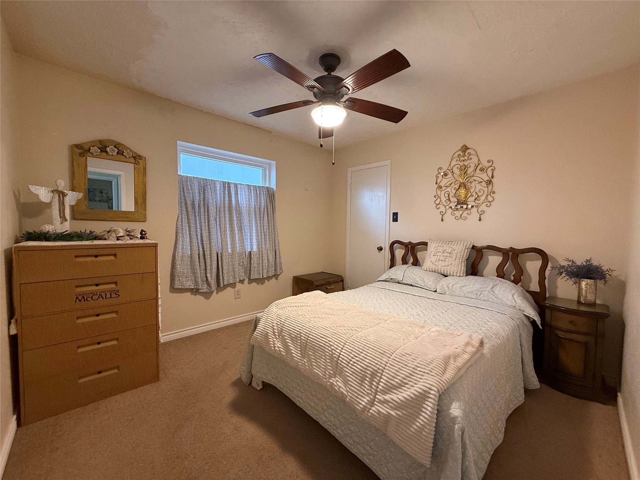 4831 Diehlwood Place Spring, TX 77388 - Photo 9 of 12 a bedroom with a bed and a chandelier
