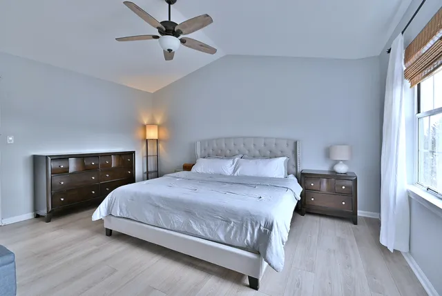 a bedroom with a bed and window