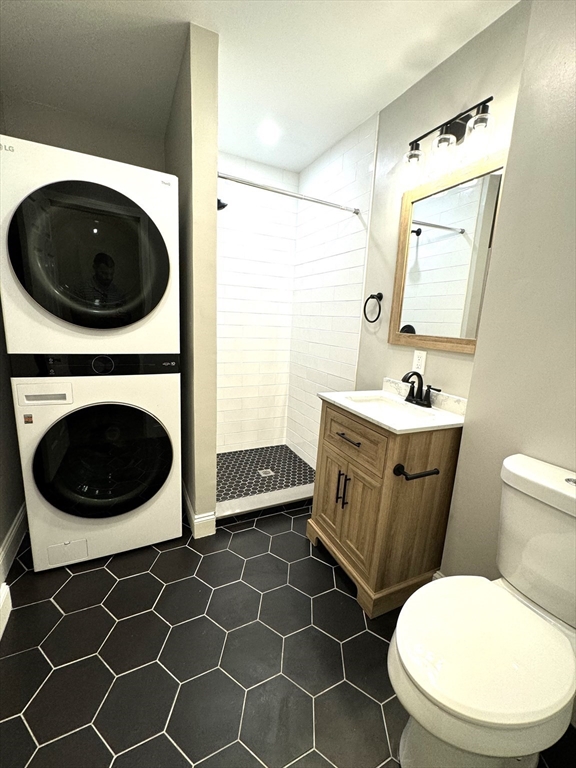 11 East Milton Road, Unit 1 Brookline, MA 02445 - Photo 18 of 24 a bathroom with a toilet a sink and a mirror
