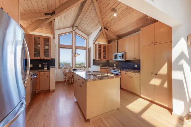 a very nice looking kitchen with a large window