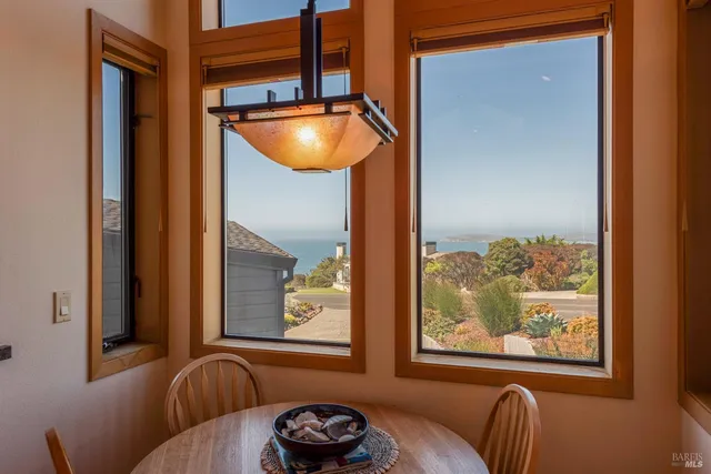 a kitchen with a sink and large window