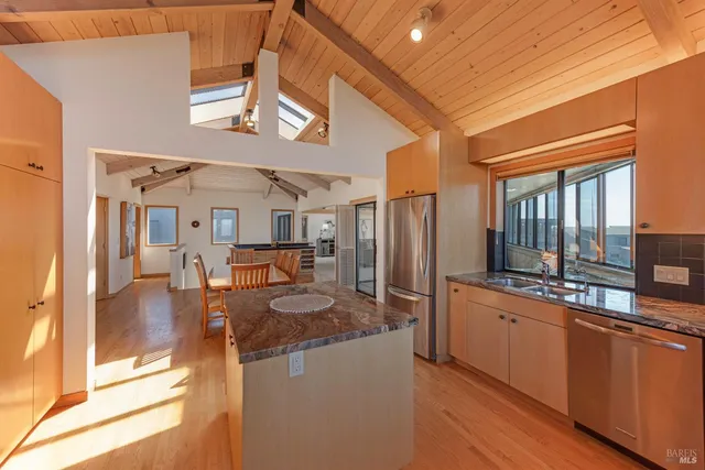 a view of a balcony dining room and wooden floor