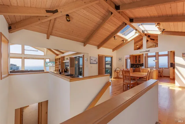 a bedroom with a large bed and a large window