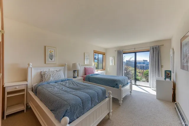 a table and chairs in front of a house
