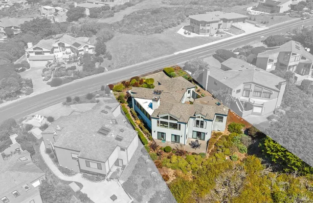 view of a swimming pool with outdoor seating and deck