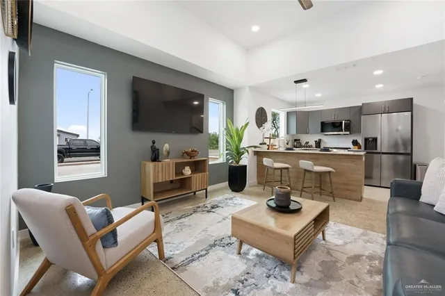 a kitchen with a refrigerator and a sink