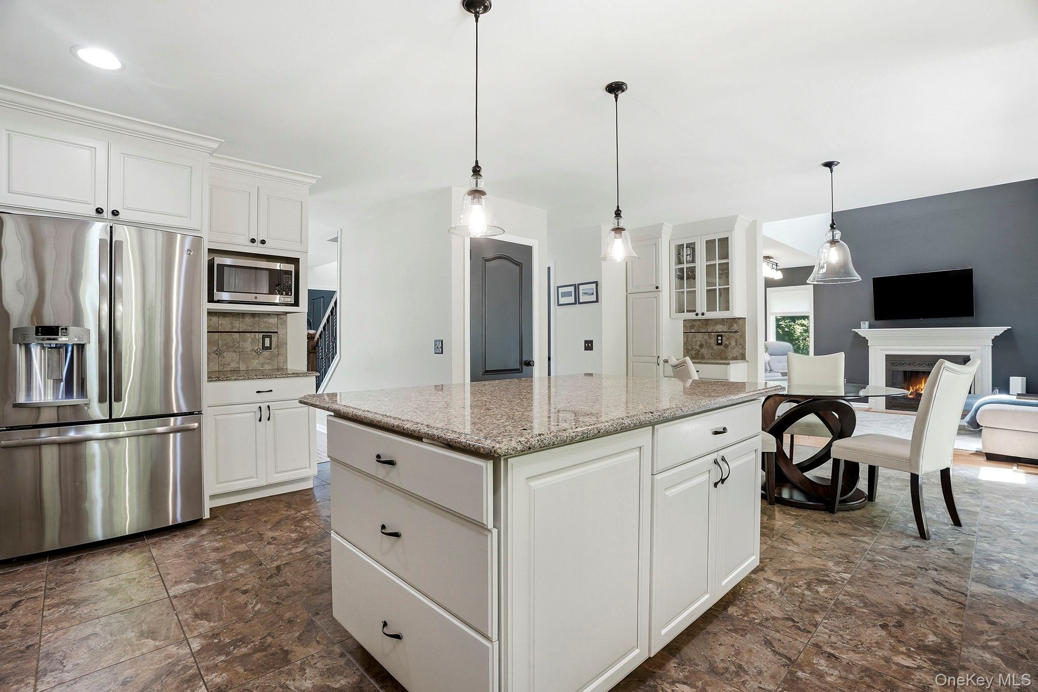 31 Ridge Road Cortlandt Manor, NY 10567 - Photo 14 of 39 Open to all - the kitchen as hub of the home easily connects to the family room, current office and dining room.