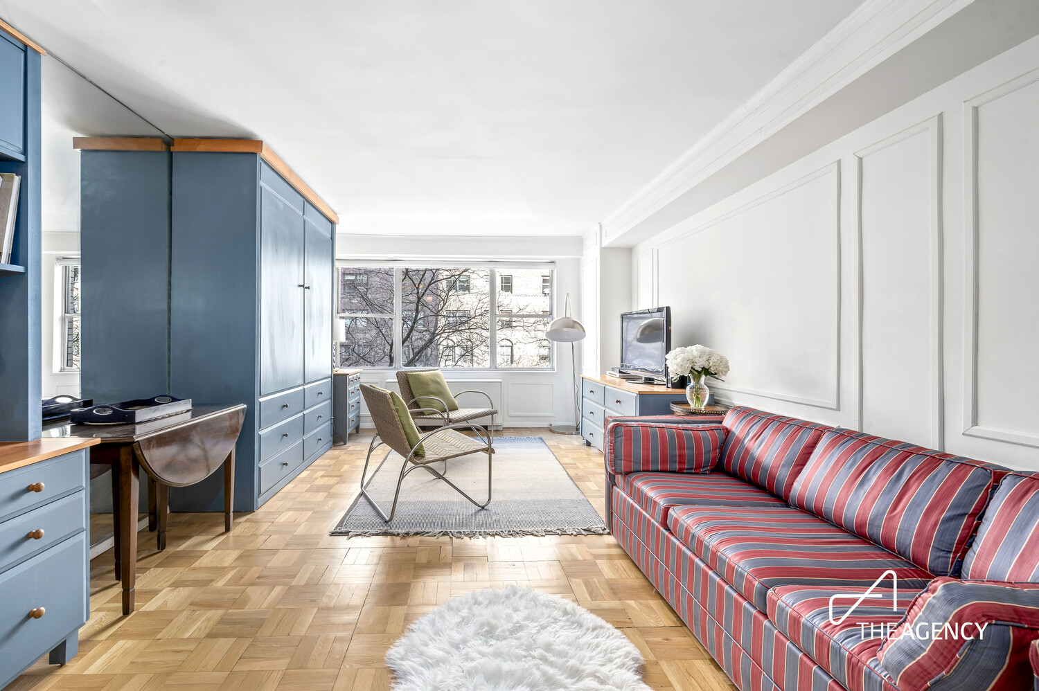 a living room with furniture and a window