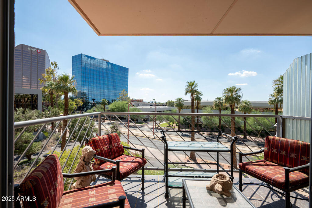 a view of a chairs and table in patio