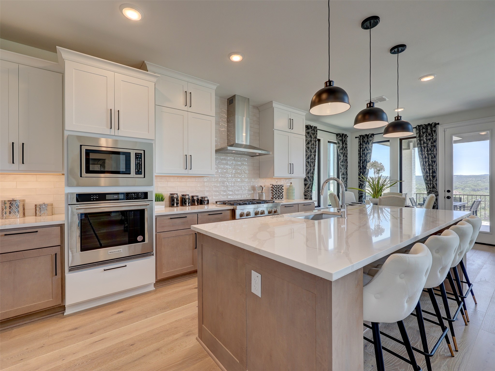 6220 Bower Well Road Austin, TX 78738 - Photo 9 of 28 Culinary excellence awaits in this well-appointed kitchen, featuring a spacious island and expansive views.