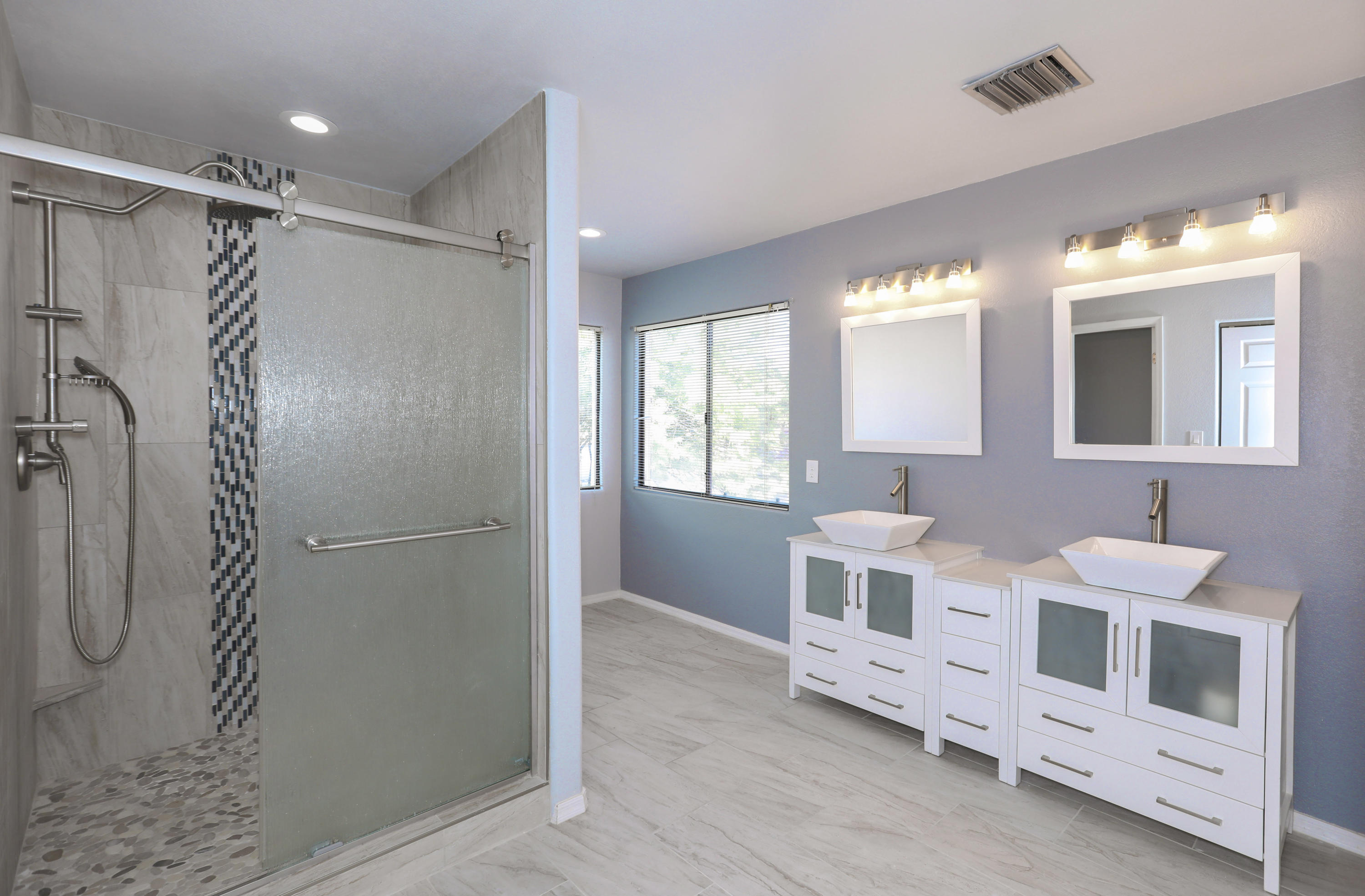 12560 North Wayfarer Way Oro Valley, AZ 85755 - Photo 32 of 43 a bathroom with double vanity and a shower