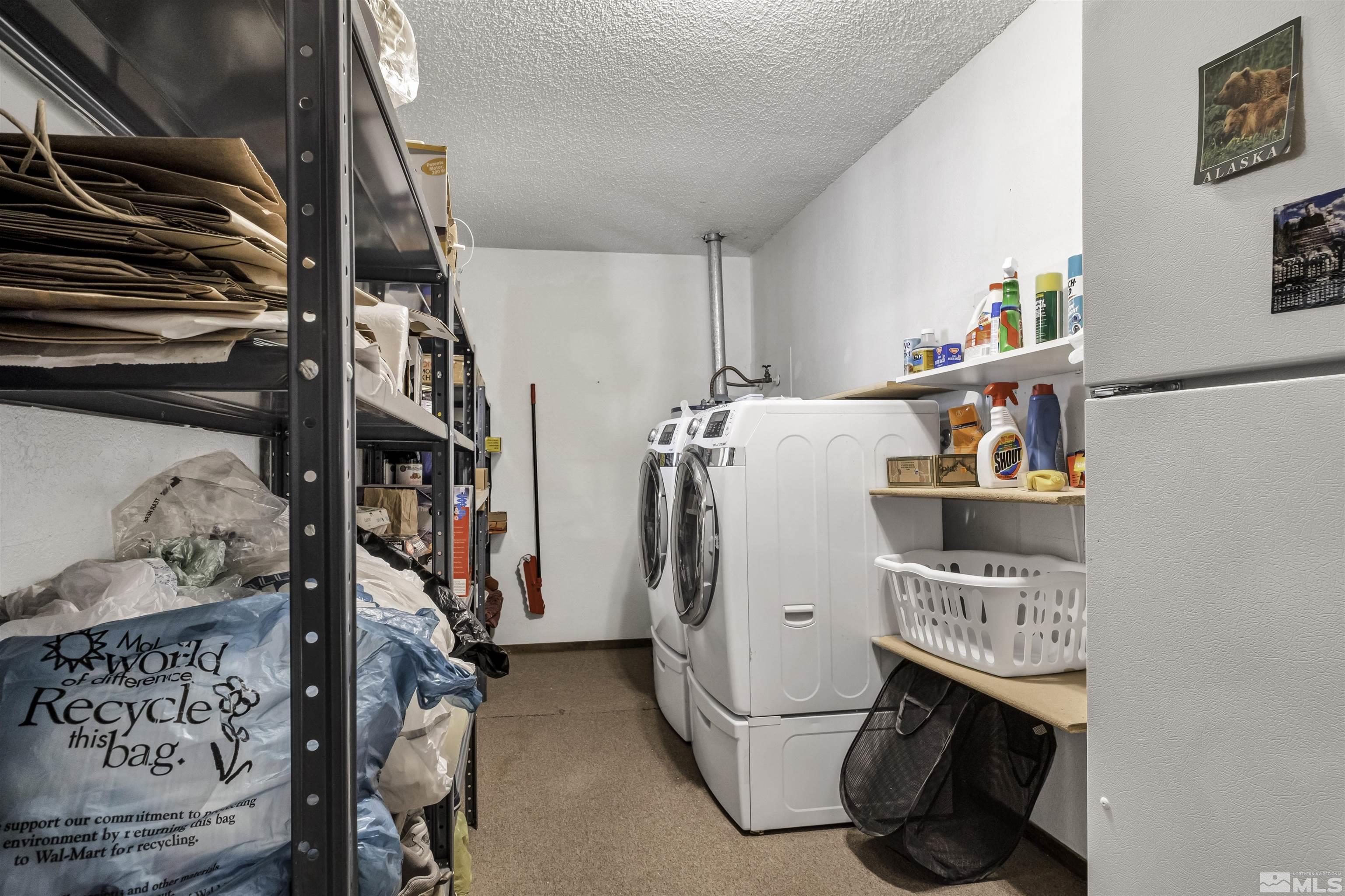 174 Juniper Drive Stateline, NV 89449 - Photo 17 of 32 a storage room with washer and dryer