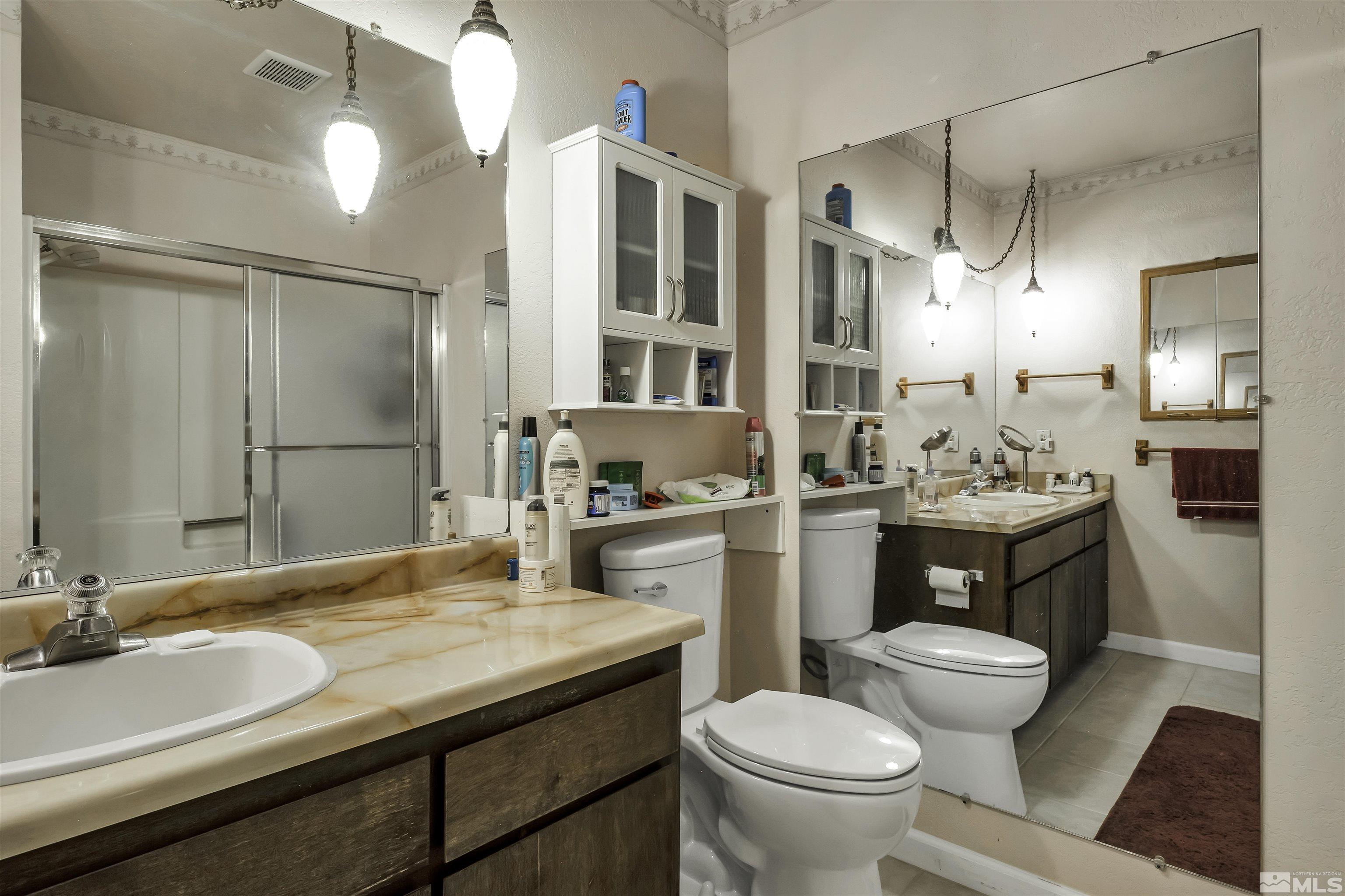 174 Juniper Drive Stateline, NV 89449 - Photo 23 of 32 a bathroom with a granite countertop sink toilet and shower