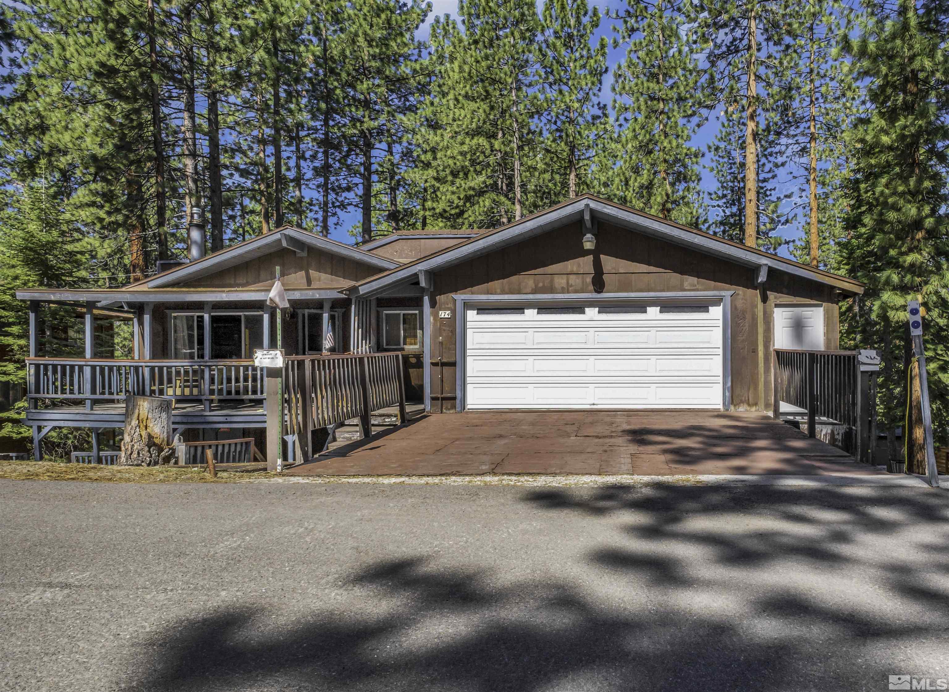 174 Juniper Drive Stateline, NV 89449 - Photo 3 of 32 a front view of a house with a yard