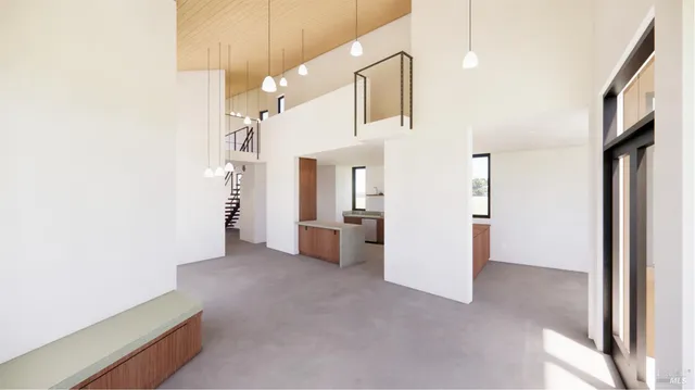 a view of a big room with closet and windows