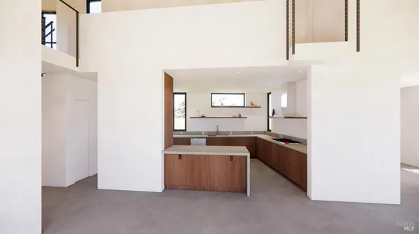 a kitchen with stainless steel appliances granite countertop a sink and a stove