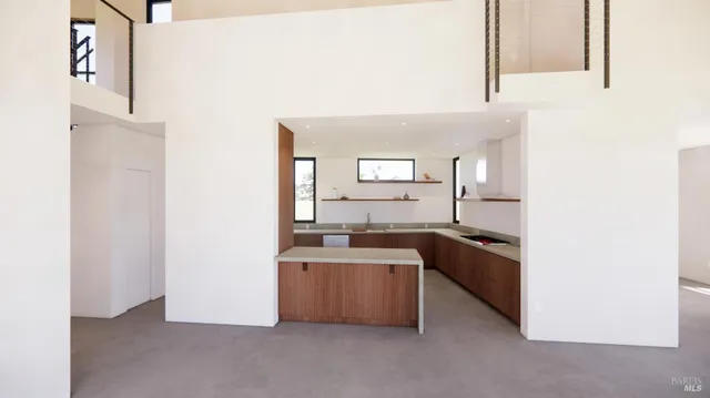 a kitchen with stainless steel appliances granite countertop a sink and a stove
