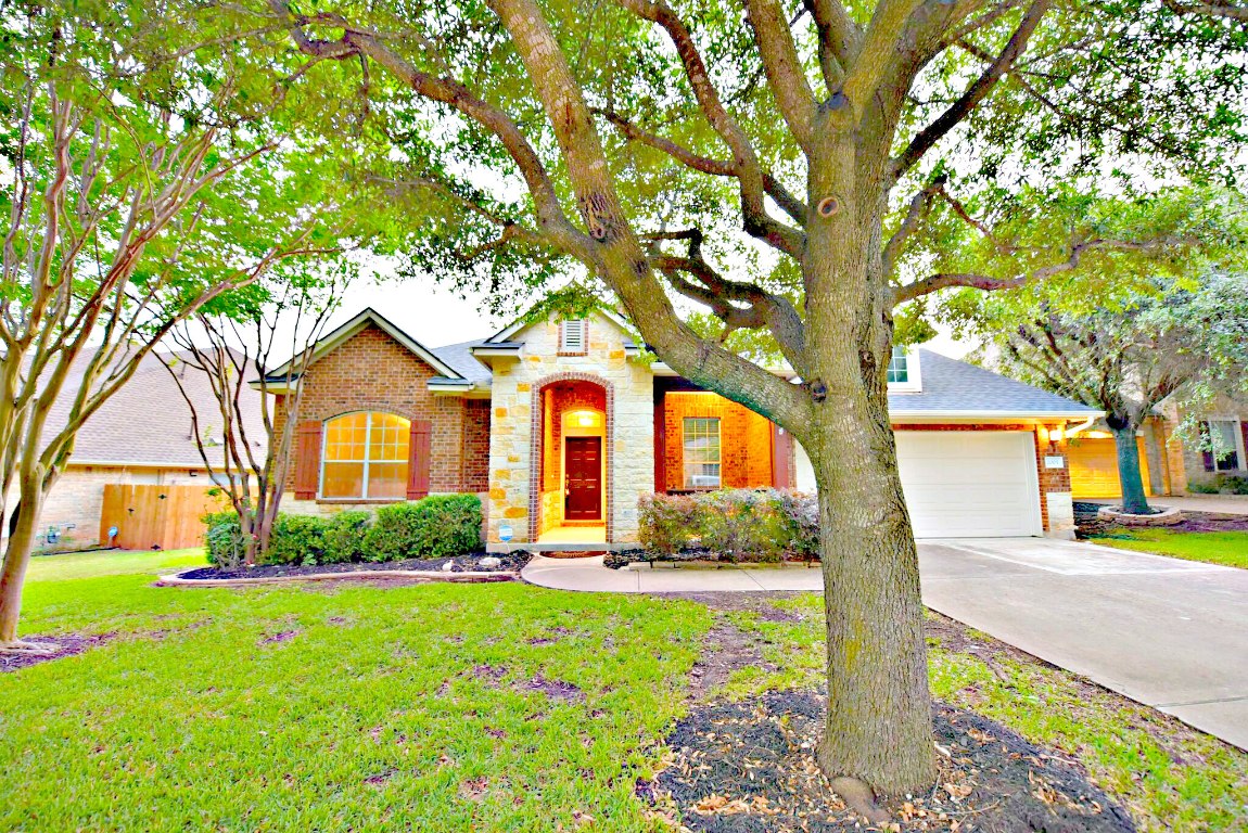 2005 Tillman Drive Cedar Park, TX 78613 - Photo 1 of 1 a front view of a house with garden