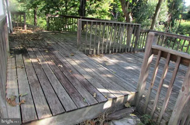 a balcony with wooden floor