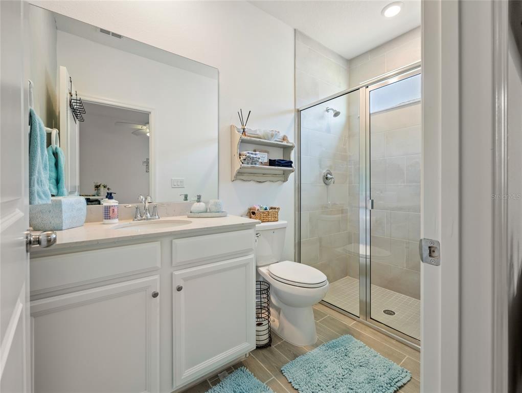 7580 Southwest 78th Terrace Ocala, FL 34481 - Photo 22 of 48 a bathroom with a sink a toilet and shower