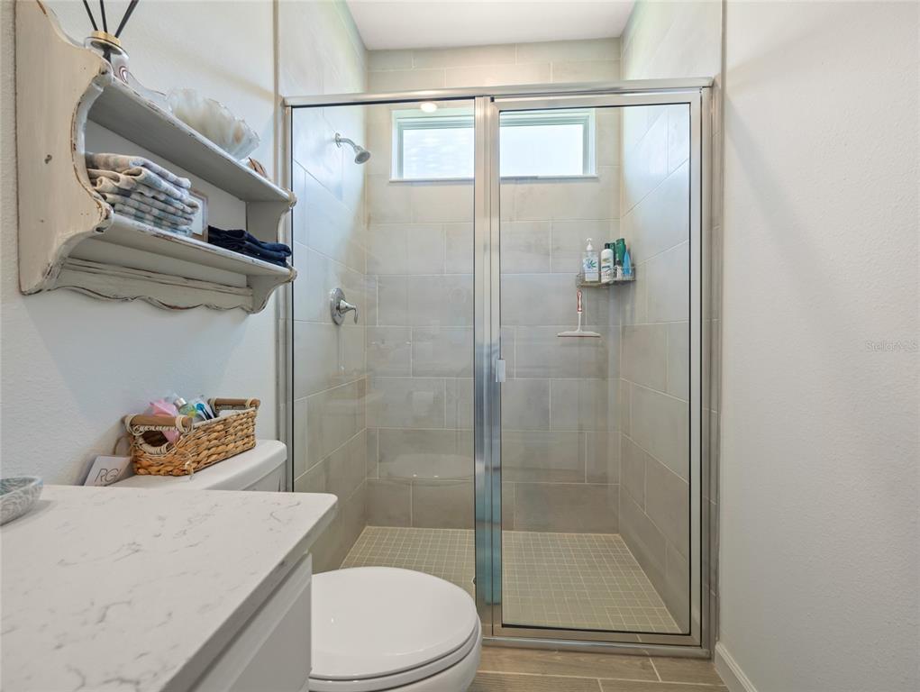 7580 Southwest 78th Terrace Ocala, FL 34481 - Photo 23 of 48 a bathroom with a sink toilet and shower