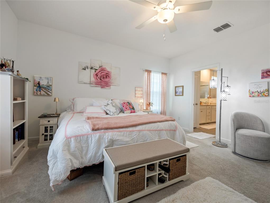 7580 Southwest 78th Terrace Ocala, FL 34481 - Photo 27 of 48 a bedroom with a bed and a couch