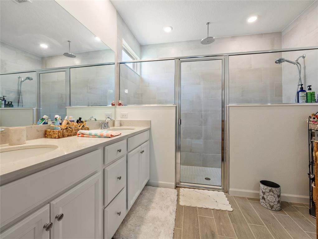 7580 Southwest 78th Terrace Ocala, FL 34481 - Photo 28 of 48 a bathroom with a double vanity sink and mirror