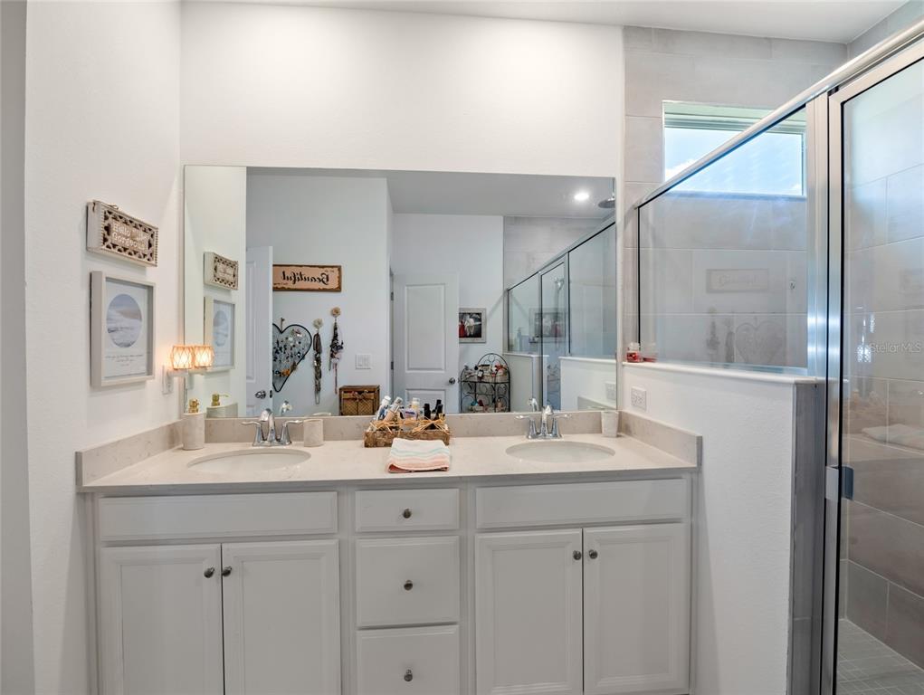 7580 Southwest 78th Terrace Ocala, FL 34481 - Photo 30 of 48 a bathroom with a double vanity sink and a mirror