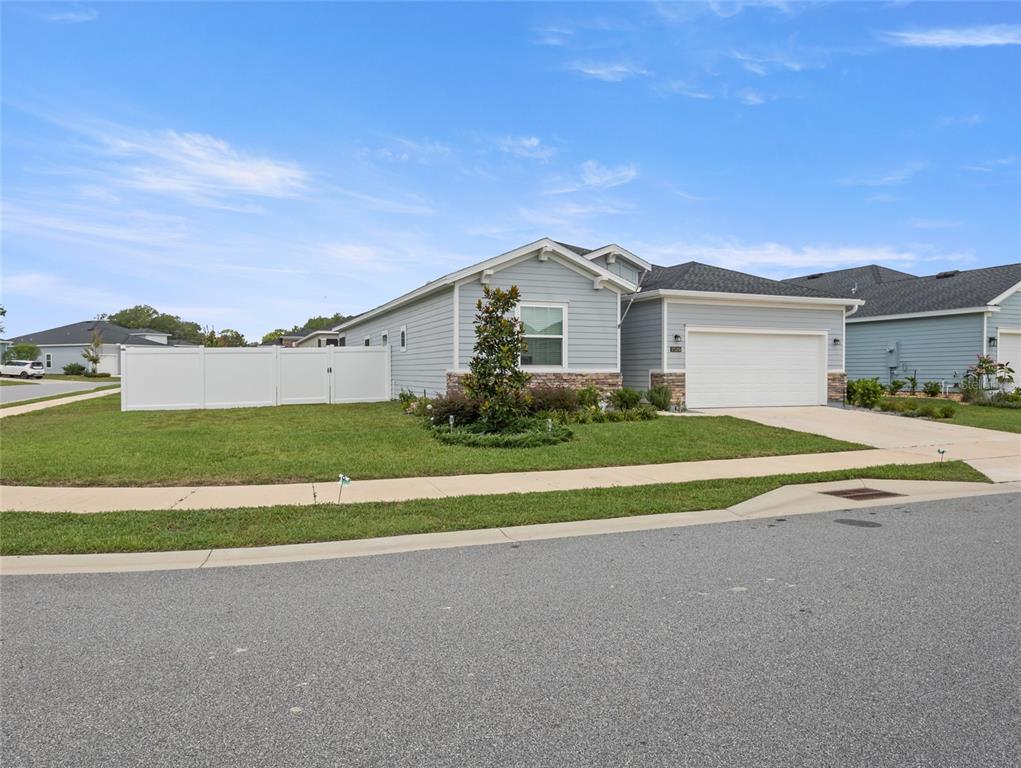 7580 Southwest 78th Terrace Ocala, FL 34481 - Photo 3 of 48 a view of house with a big yard and palm trees