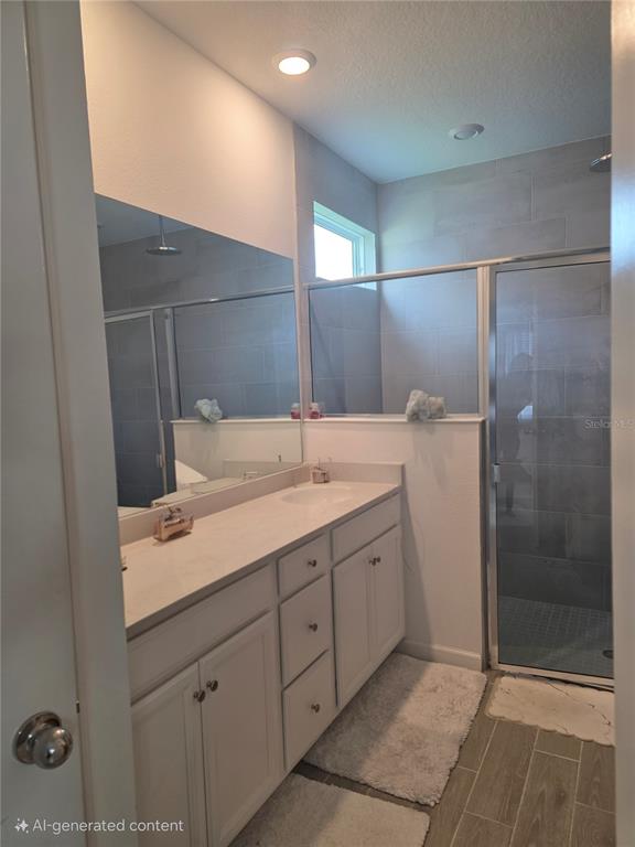 7580 Southwest 78th Terrace Ocala, FL 34481 - Photo 46 of 48 a bathroom with a shower sink and mirror