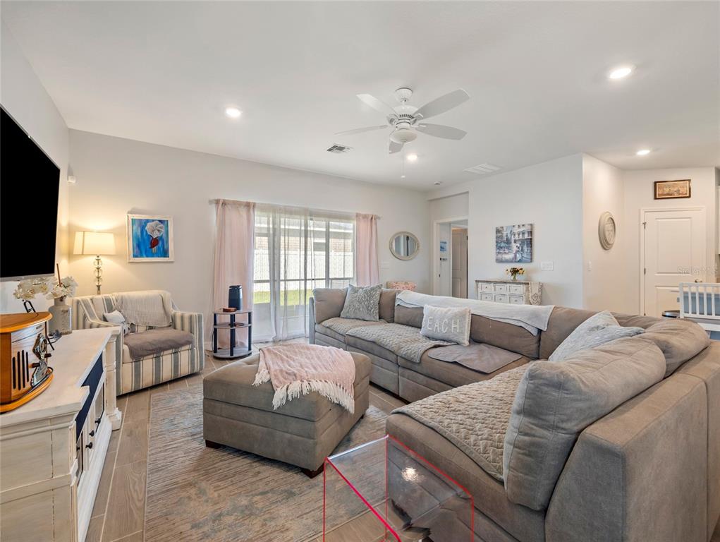 7580 Southwest 78th Terrace Ocala, FL 34481 - Photo 6 of 48 a living room with furniture and a flat screen tv