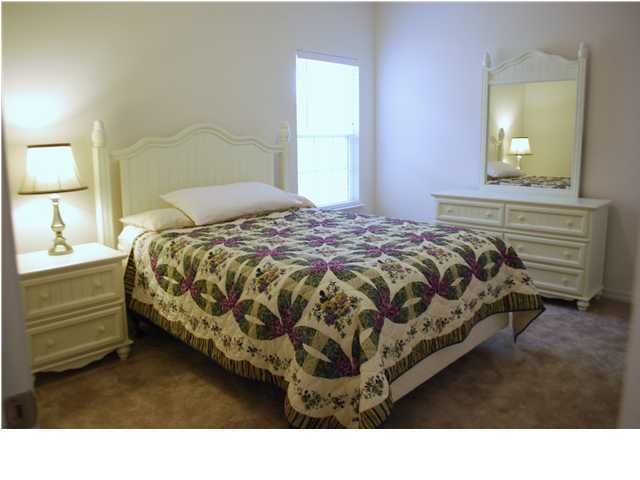 54 Maple Street Santa Rosa Beach, FL 32459 - Photo 5 of 9 a bedroom with a bed and a dresser