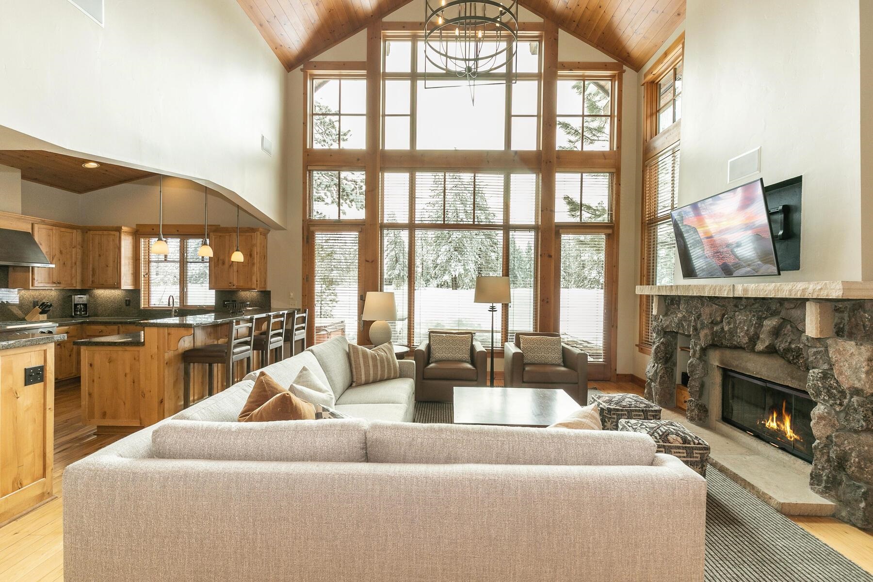 12247 Lookout Loop, Unit F603 Truckee, CA 96161 - Photo 9 of 28 a living room with furniture large windows and a fireplace