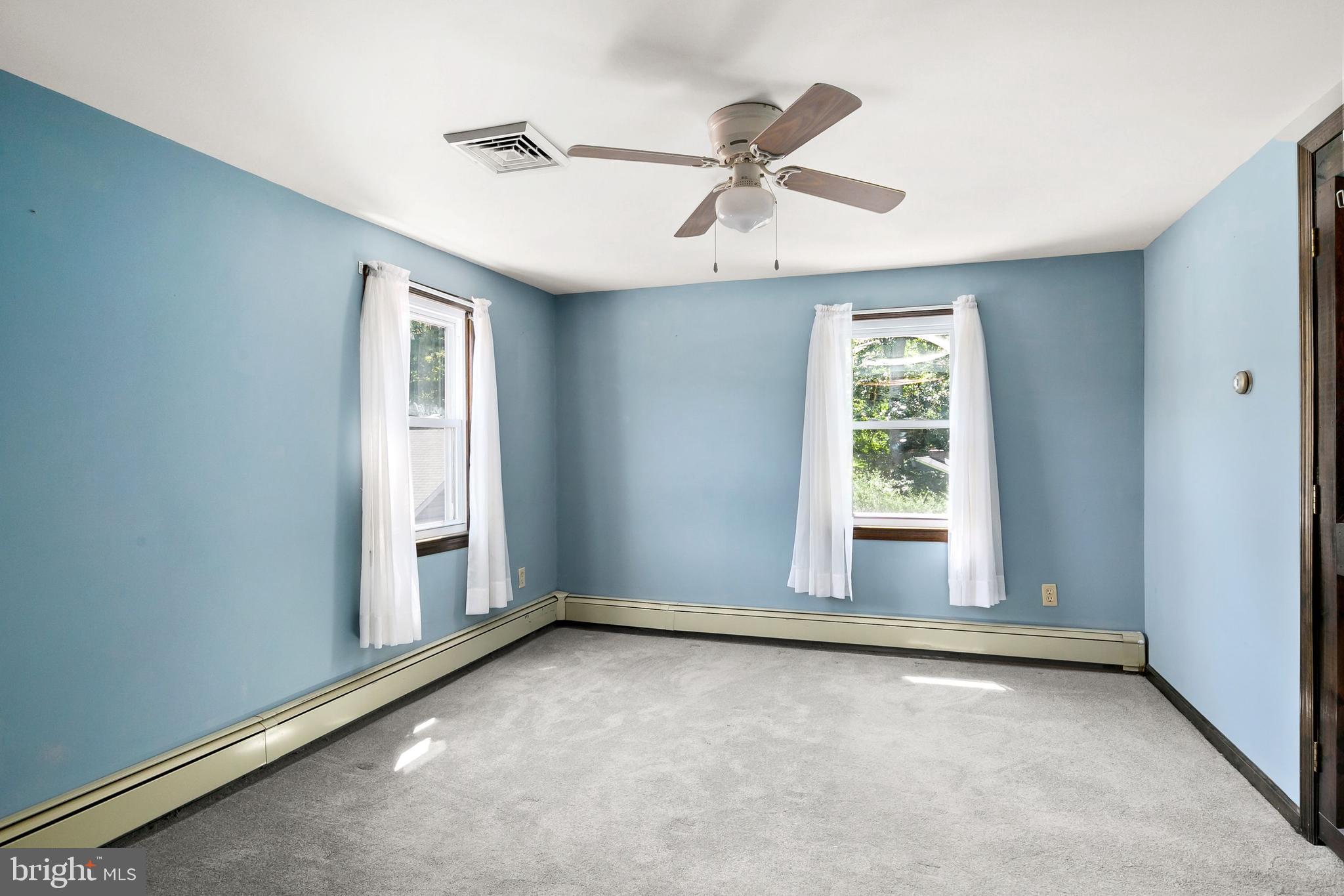 86 Hopkins Road New Egypt, NJ 08533 - Photo 14 of 37 an empty room with windows and fan