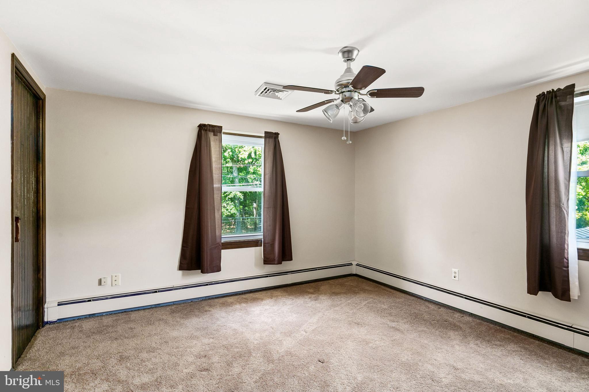 86 Hopkins Road New Egypt, NJ 08533 - Photo 16 of 37 an empty room with windows and ceiling fan