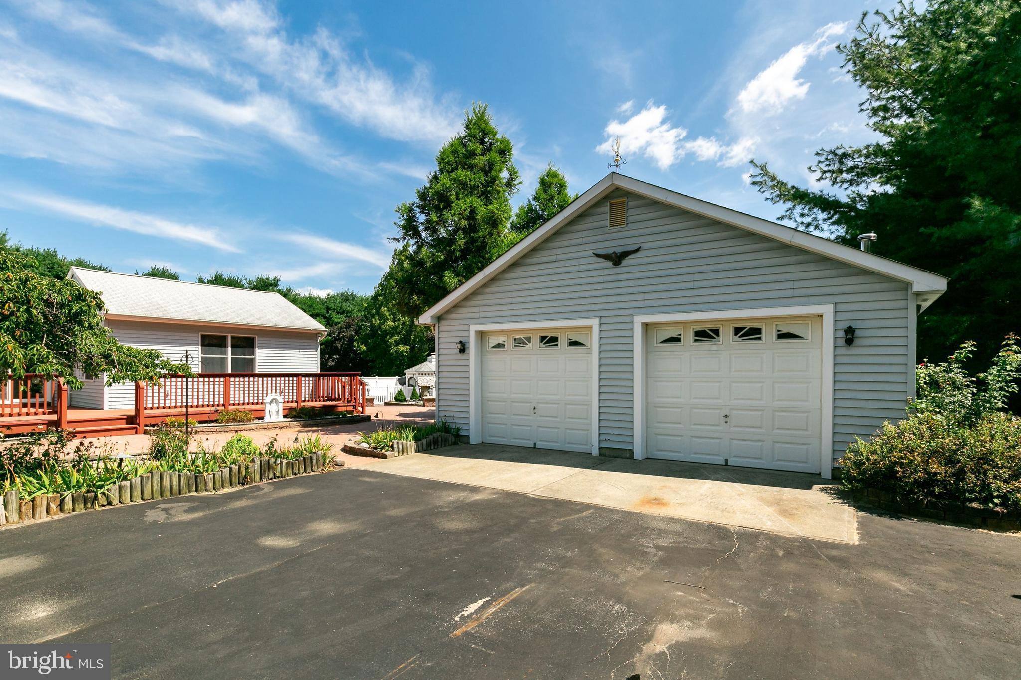 86 Hopkins Road New Egypt, NJ 08533 - Photo 20 of 37 a view of a house with a yard and garage