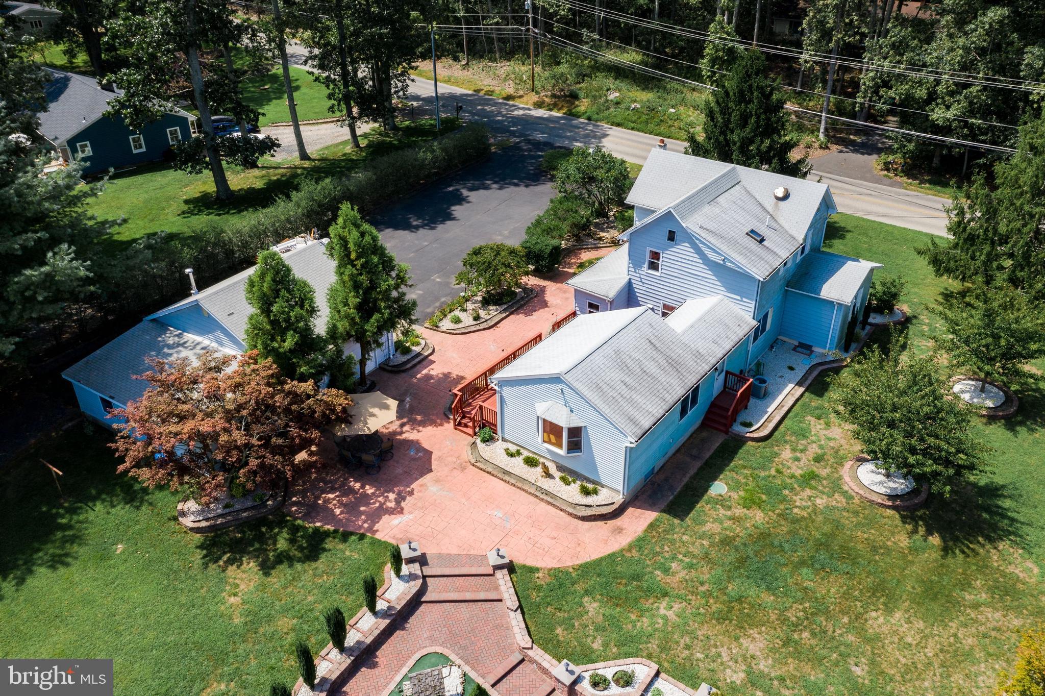 86 Hopkins Road New Egypt, NJ 08533 - Photo 33 of 37 an aerial view of a house with a garden and lake view
