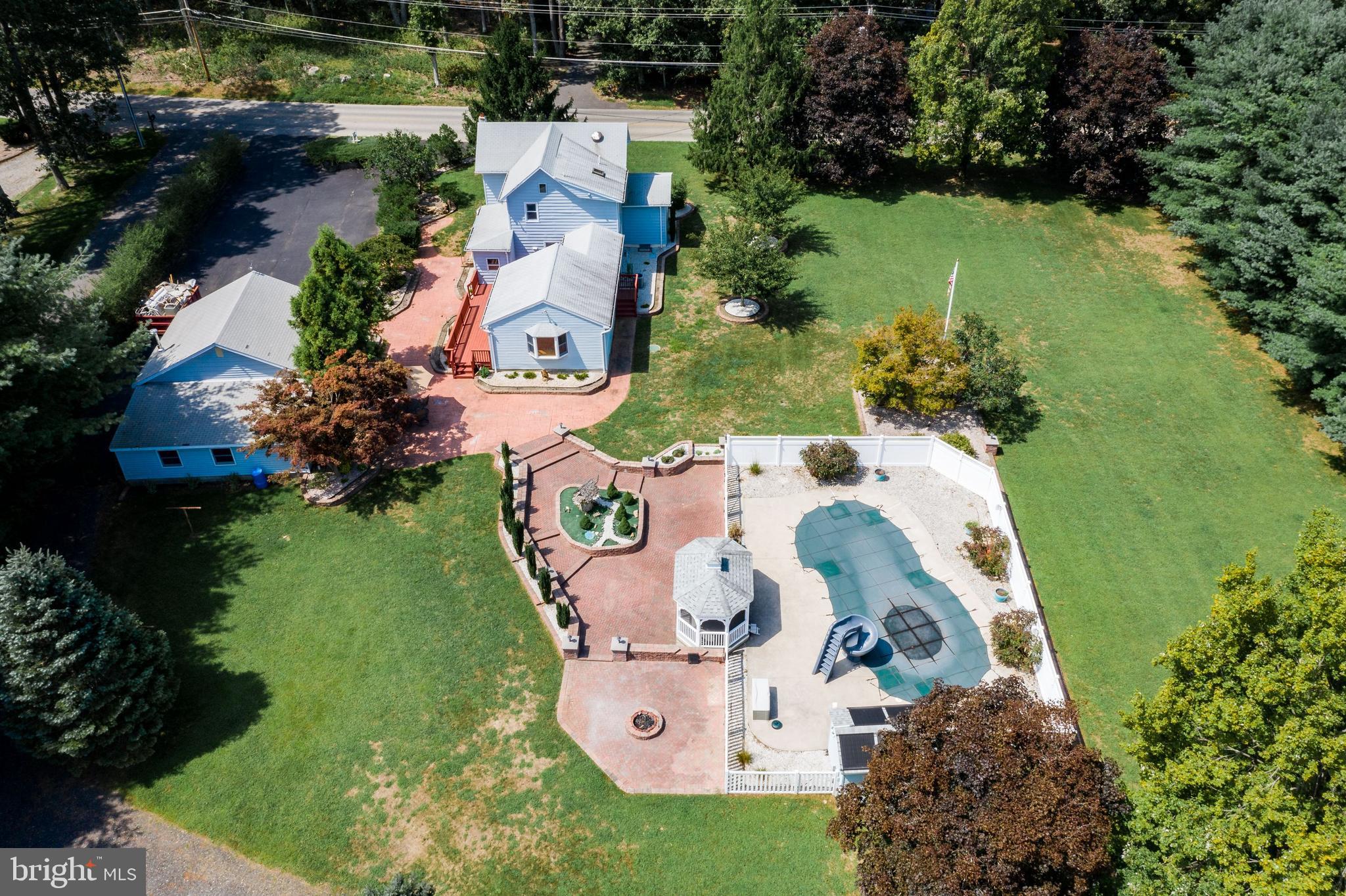 86 Hopkins Road New Egypt, NJ 08533 - Photo 34 of 37 an aerial view of a house with a yard and lake view