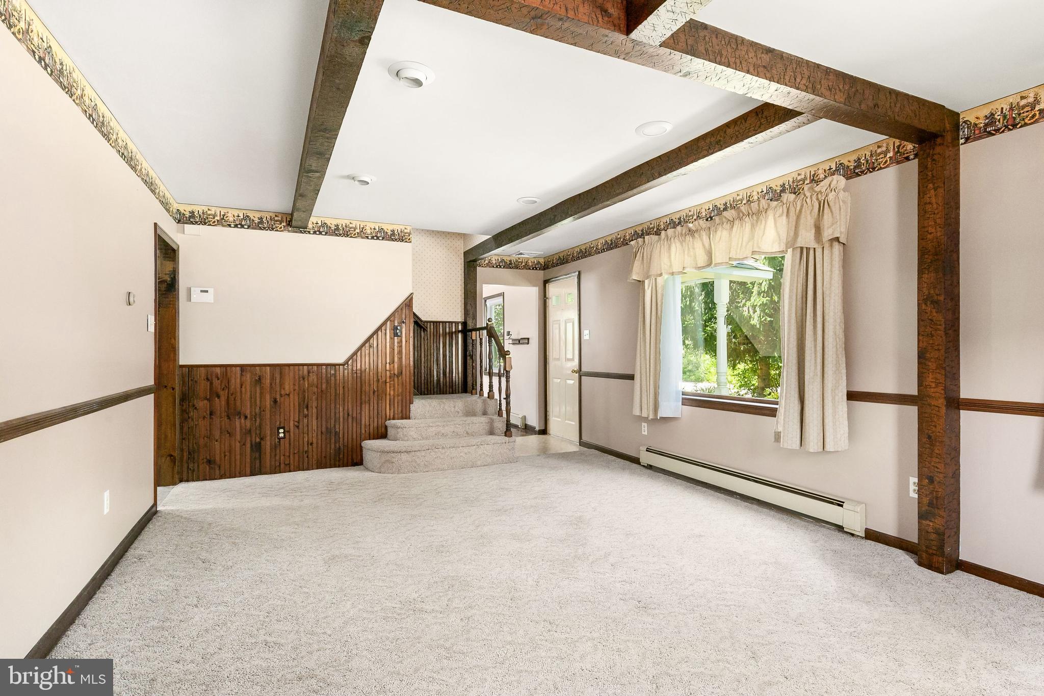 86 Hopkins Road New Egypt, NJ 08533 - Photo 10 of 37 a view of a big room with wooden floor and windows