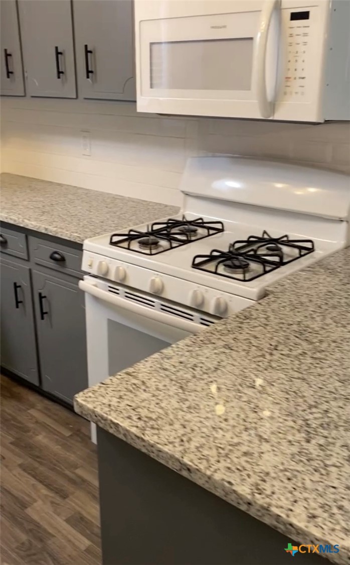 1316 Opal Road, Unit A Killeen, TX 76543 - Photo 24 of 25 a white stove top oven sitting inside of a kitchen