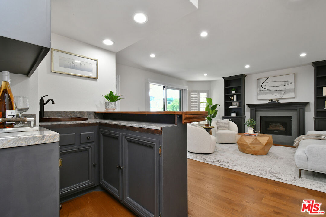 10409 Riverside Drive, Unit 204 Toluca Lake, CA 91602 - Photo 11 of 36 a kitchen with sink refrigerator and stove