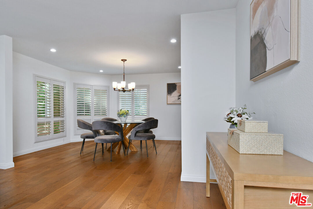 10409 Riverside Drive, Unit 204 Toluca Lake, CA 91602 - Photo 13 of 36 a view of a dining room with furniture window and wooden floor