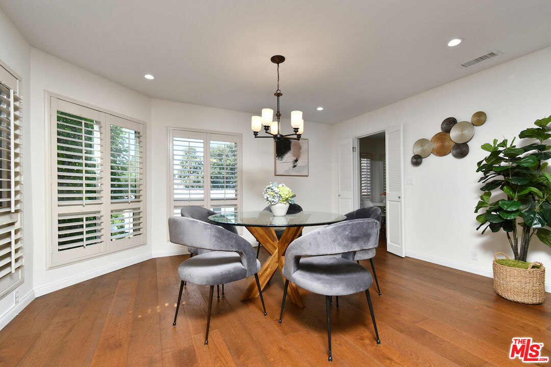 10409 Riverside Drive, Unit 204 Toluca Lake, CA 91602 - Photo 14 of 36 a view of a dining room with furniture window and wooden floor