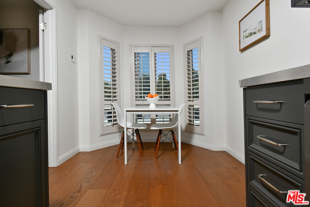 10409 Riverside Drive, Unit 204 Toluca Lake, CA 91602 - Photo 18 of 36 a workspace with furniture window and wooden floor