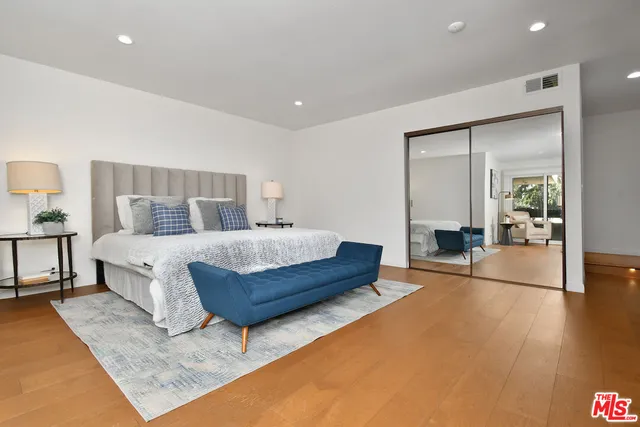 a living room with furniture and a lamp