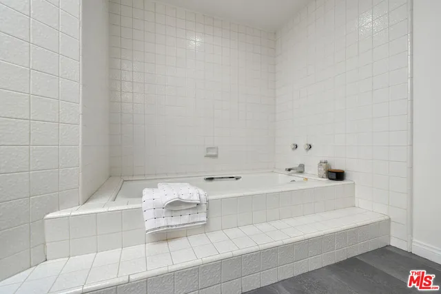 a workspace with wooden floor and furniture