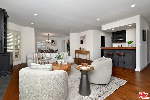 a kitchen with stainless steel appliances kitchen island a stove and a microwave